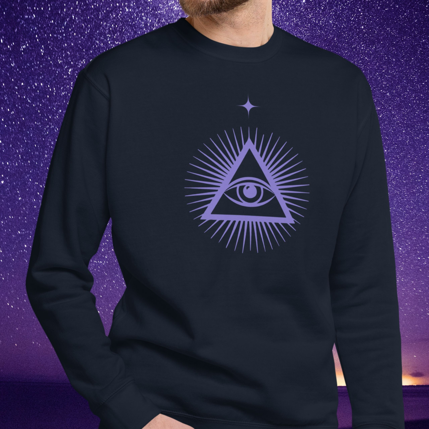 Person wearing a black Stellarwear sweatshirt with a purple triangle symbol featuring an eye on a purple starry night background.