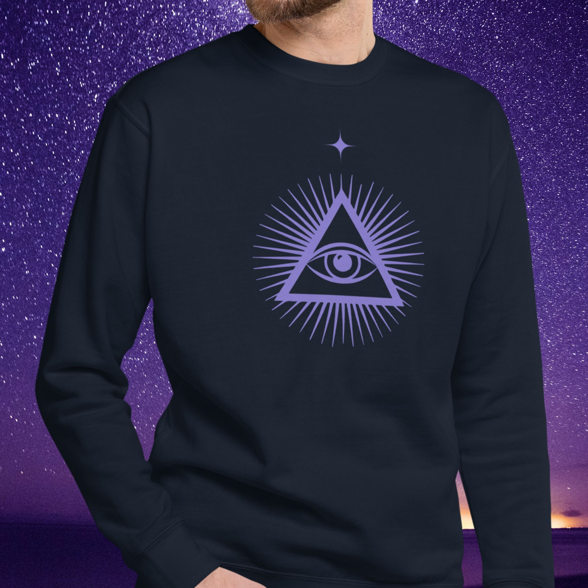 Person wearing a black Stellarwear sweatshirt with a purple triangle symbol featuring an eye on a purple starry night background.