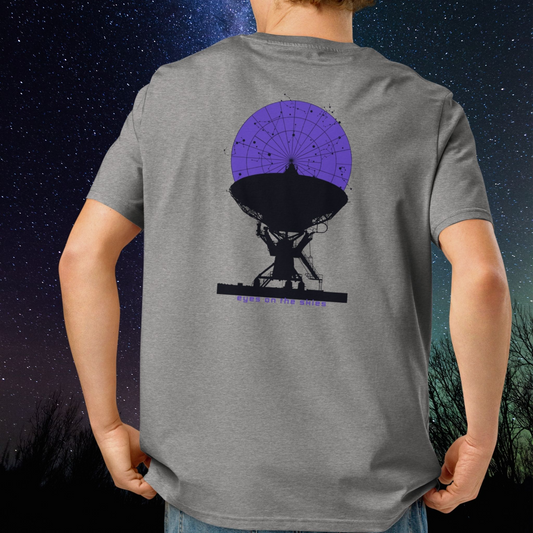 Person wearing a gray Stellarwear t-shirt with a radio telescope graphic on the back, against a starry night sky.