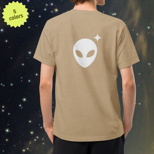 Person wearing a Stellarwear beige t-shirt with an Alienhead design on the back against a starry space background.