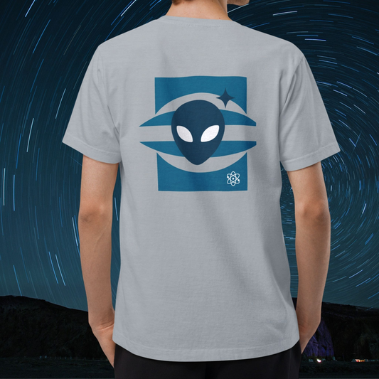 Person wearing a Stellarwear light blue t-shirt with an Alienhead UFO design on the back against a starry night sky.