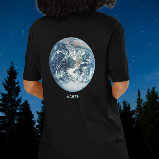 Person wearing a Stellarwear black t-shirt with an Earth graphic and 'EARTH' text, standing against a night sky with trees.