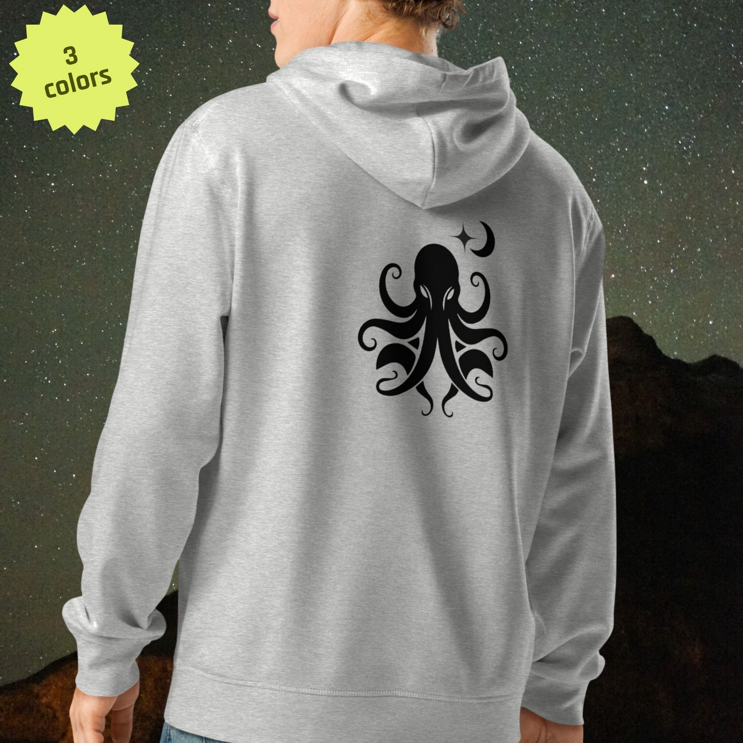 Gray Stellarwear organic cotton hoodie with black octopus design on the back, against a dark starry cosmic background.