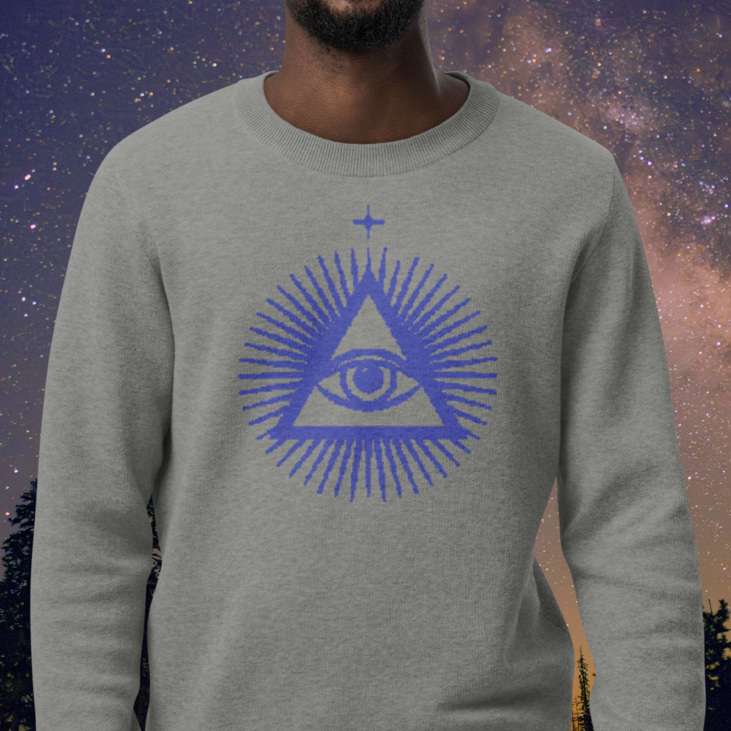 Gray Stellarwear sweatshirt with a blue pyramid and eye design against a starry night sky background