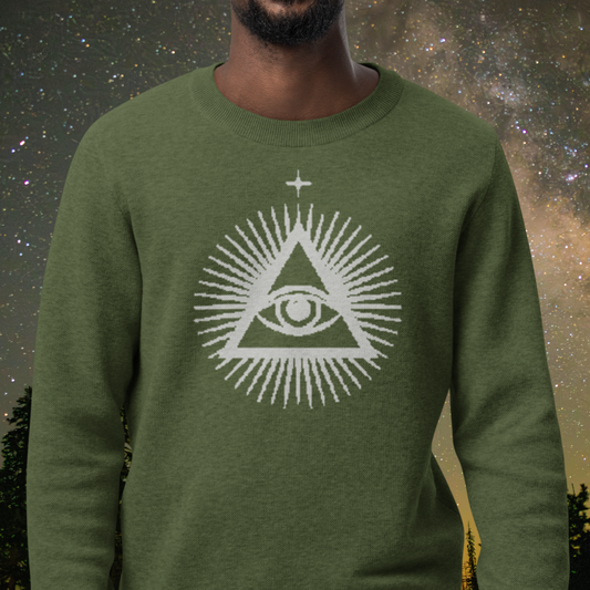 Green Stellarwear sweater with a white triangle eye design against a starry night sky background