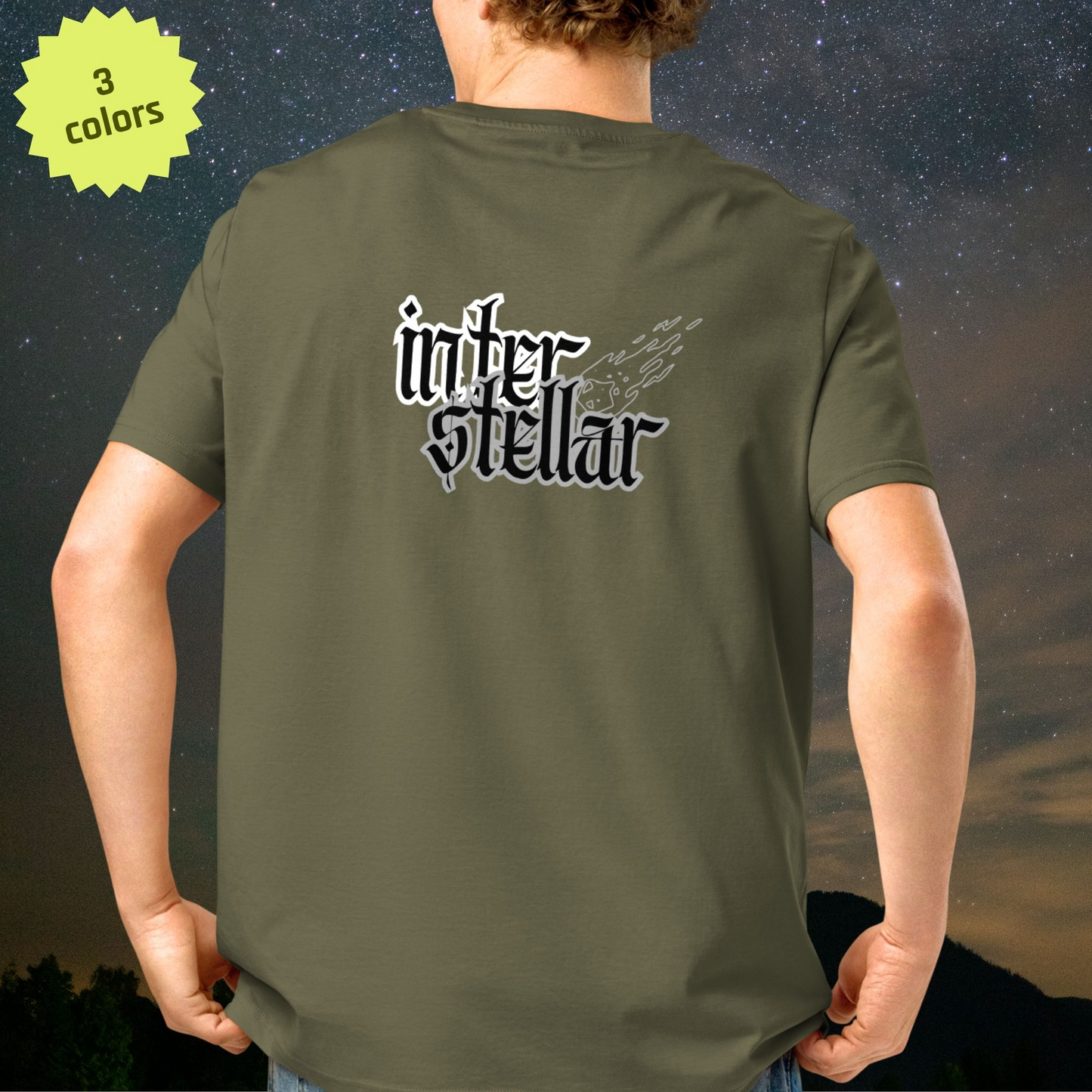 Person wearing a green Stellarwear t-shirt with 'interstellar' text on the back, against a starry night sky.
