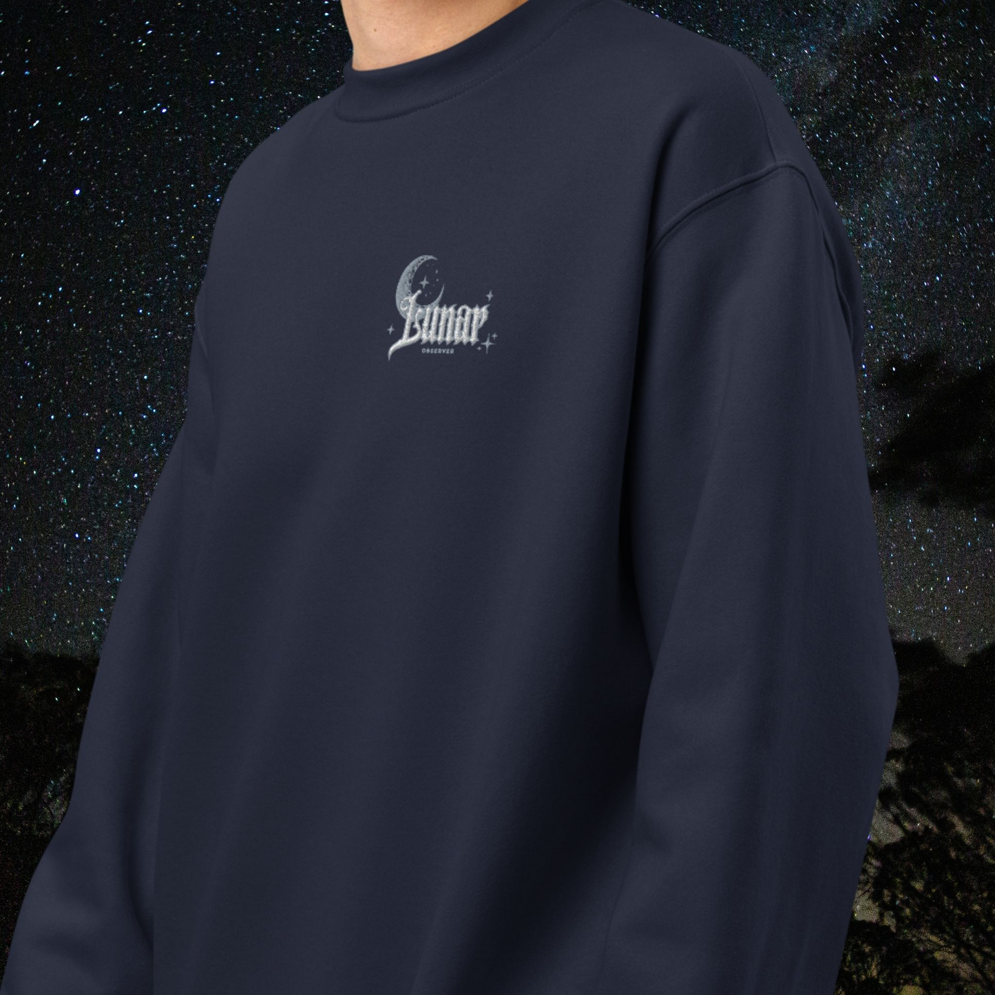 Navy blue Stellarwear sweatshirt with a lunar logo on a dark space-themed background