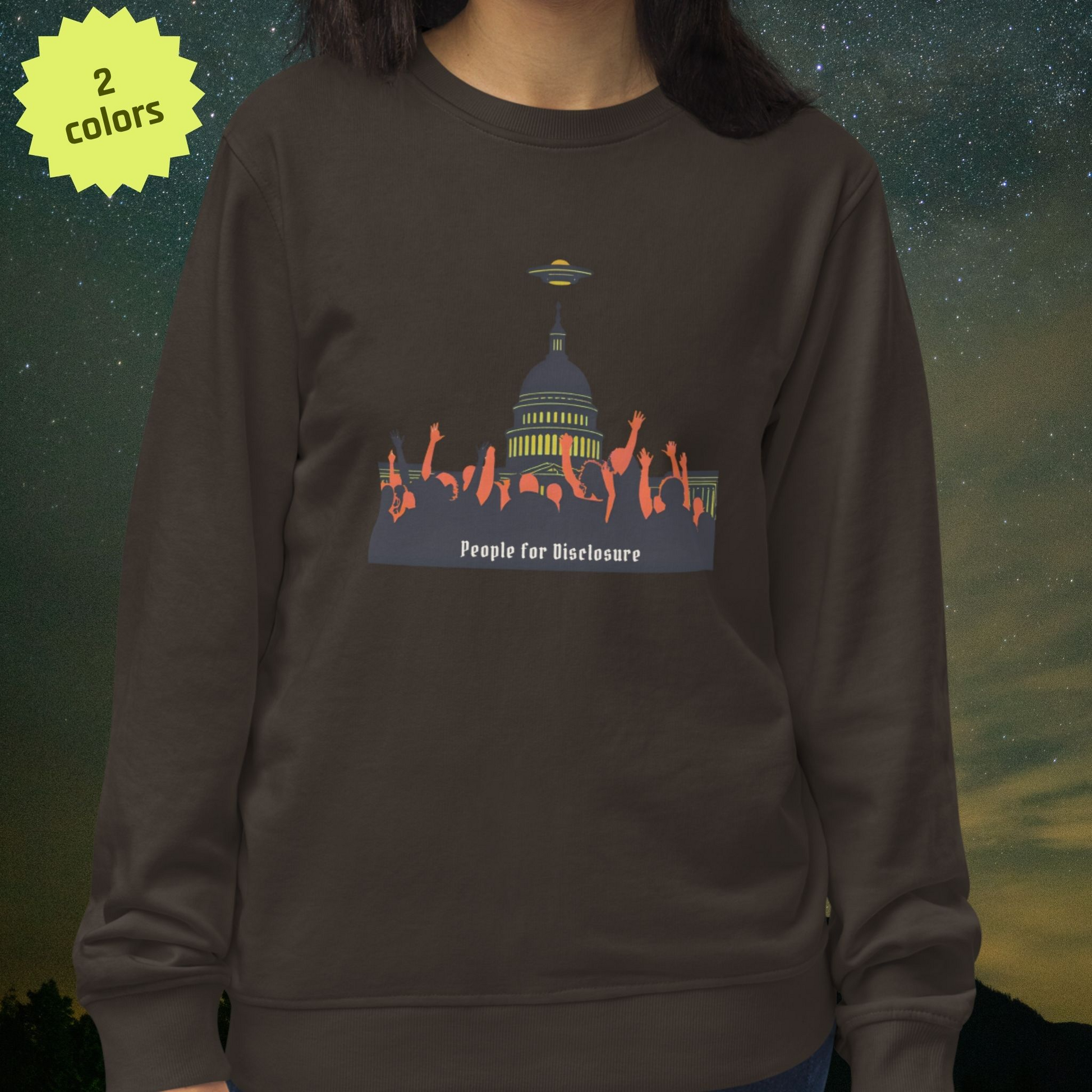 Person wearing a Stellarwear dark gray sweatshirt with a "People for Disclosure" graphic design and text on a starry night background.