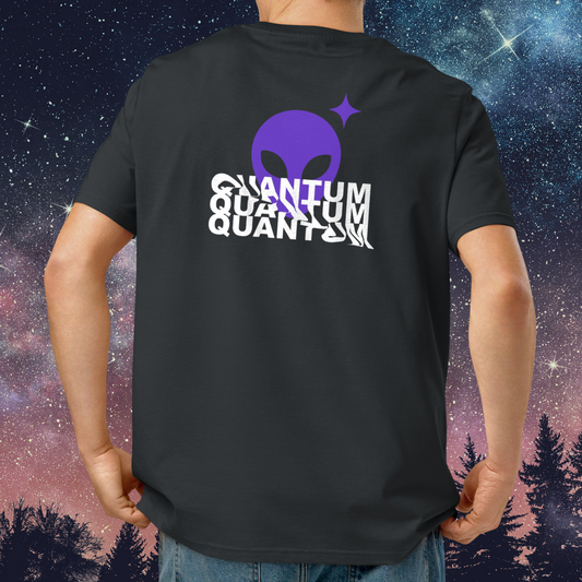 Person wearing a black Stellarwear t-shirt with a purple alien head design and 'QUANTUM' text, against a starry night sky and tree silhouette background.