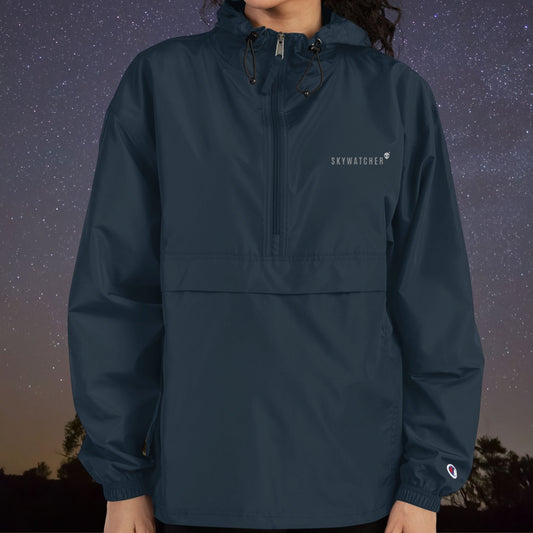 Navy Stellarwear windbreaker with 'Skywatcher' logo against a starry night sky