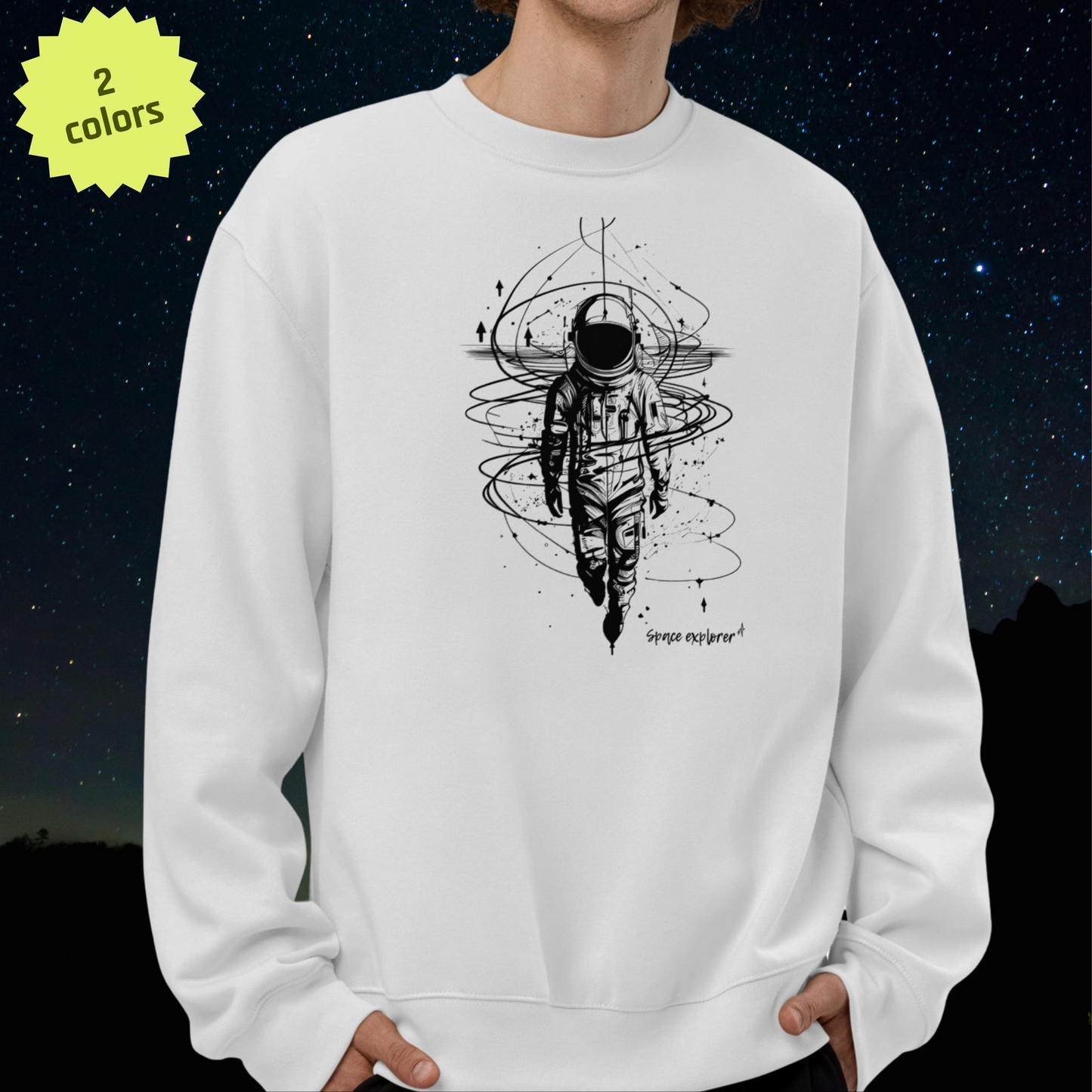 White Stellarwear sweatshirt with an astronaut design against a starry night sky background