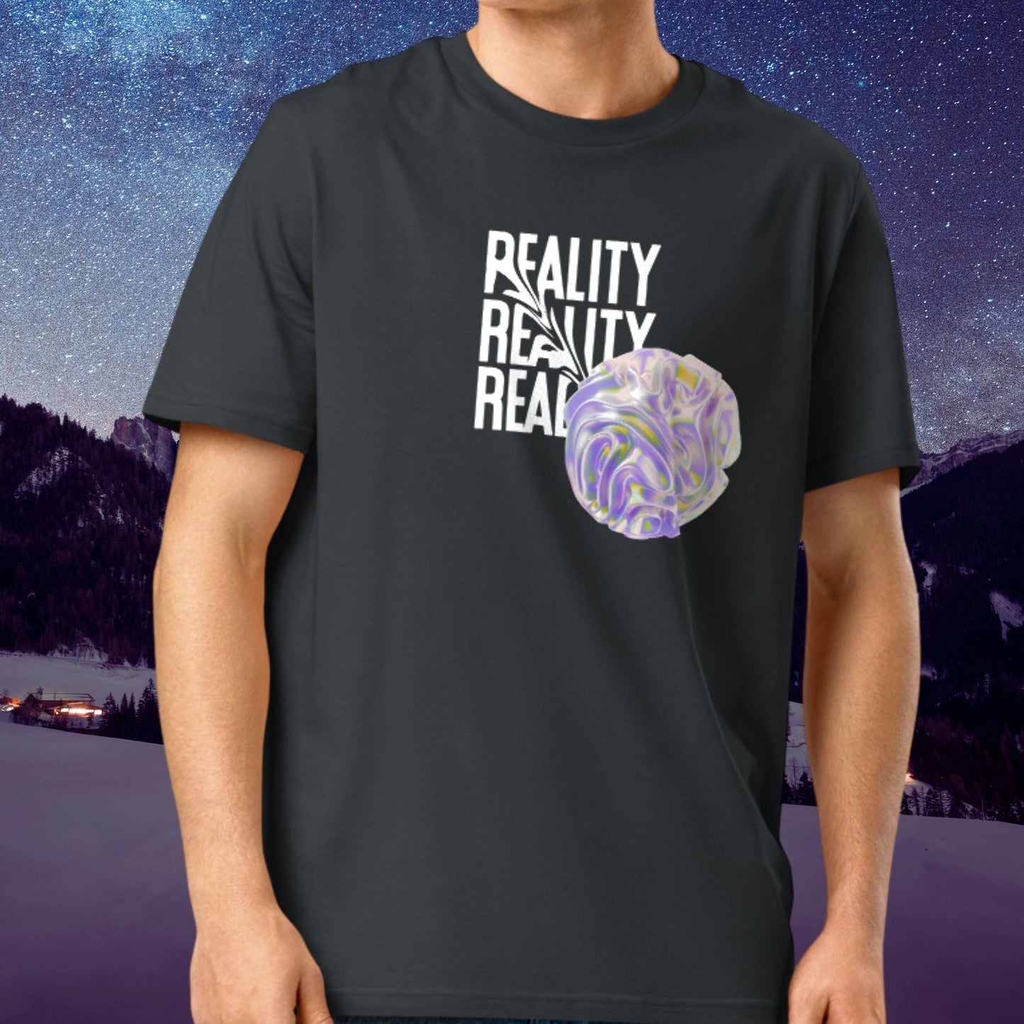 Person wearing a Stellarwear black t-shirt with 'Reality' text and a purple alien sphere graphic, set against a starry night sky and mountain landscape.
